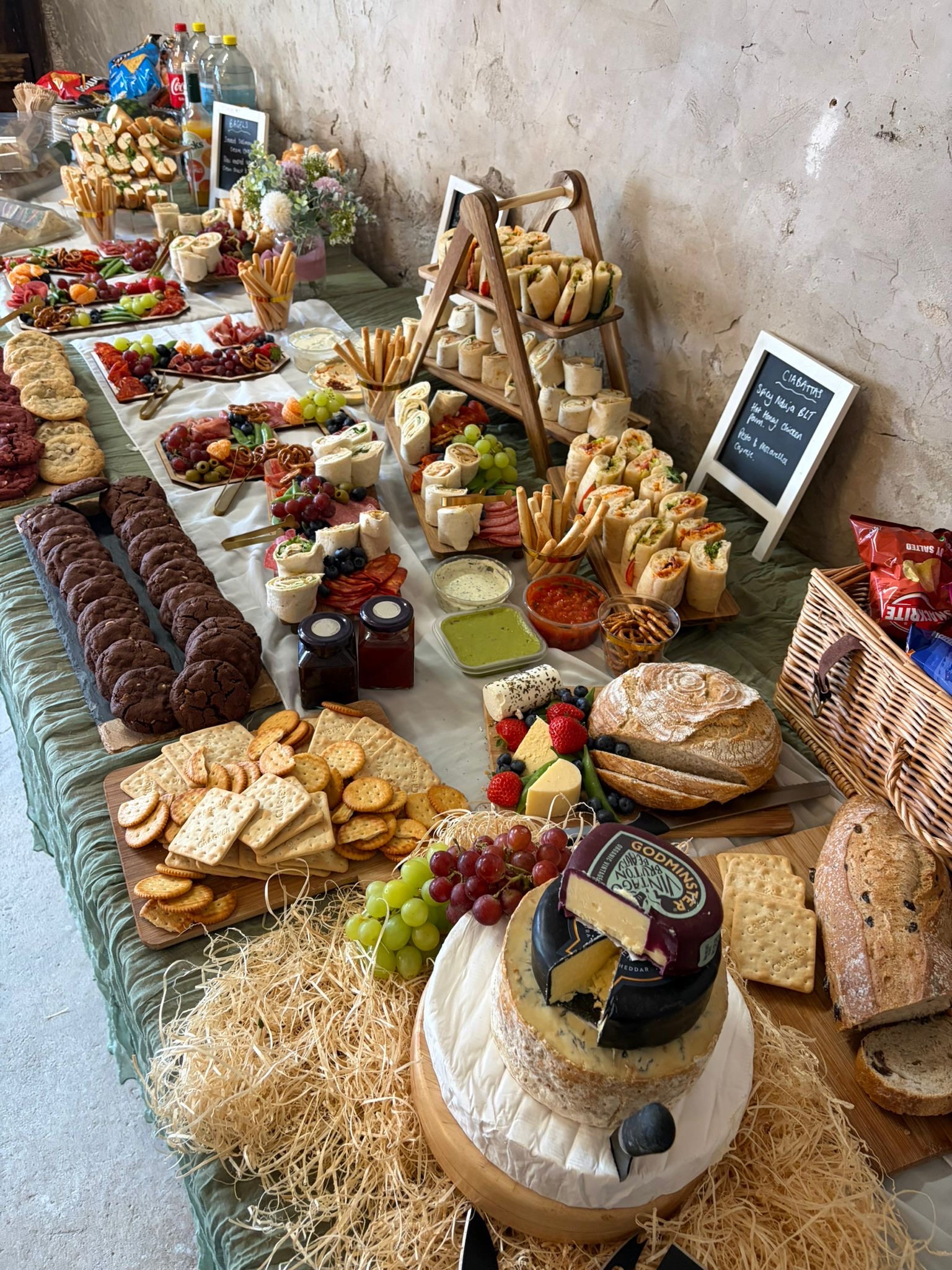 Tipsy Daisy wedding breakfast buffet table laden with sharing food