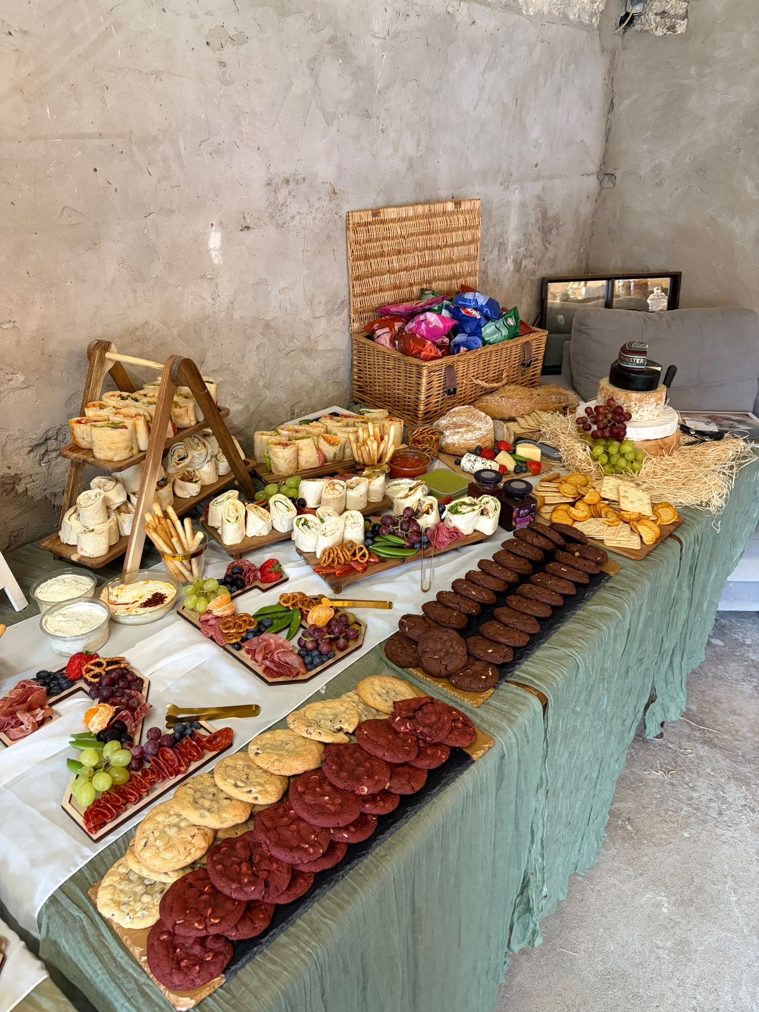 Grazing table of cheeses, breads and seasonal nibbles at a Tipsy Daisy event